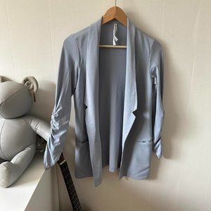 Light blue button up blazer with ruched sleeves